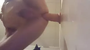 A beautiful slut in her bedroom lost in pleasure