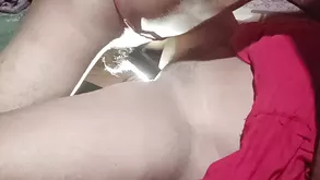 A beautiful brunette in sexy glasses is touching herself