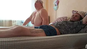 Black haired woman puts on makeup to seduce her lover with a passionate kiss