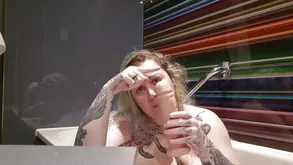 Busty beauty takes two cocks in her mouth