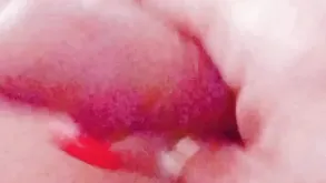 Barefoot girl masturbating herself on the bed with her fingers and a toy