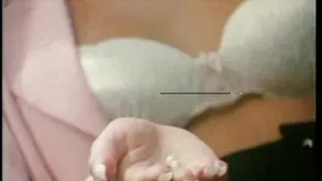 A rusted chain binds the hands of two passionate lovers