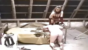 A mistress ritually punishes her slave with a cowgirl style spanking